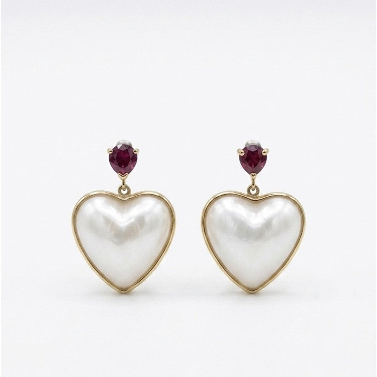 Mabe pearl heart earrings with rubies in 18K gold