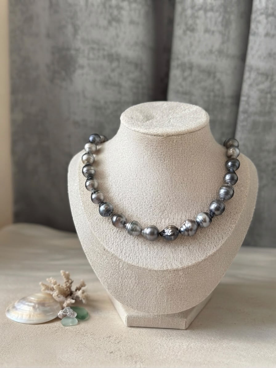 Baroque Tahitian pearl necklace on a cream display bust