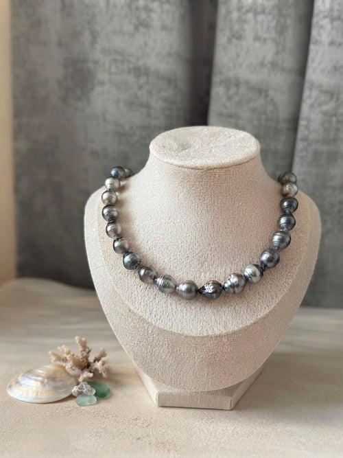 Baroque Tahitian pearl necklace on a cream display bust