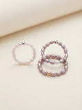 Freshwater baby pearl stacking rings in soft pink and lavender tones
