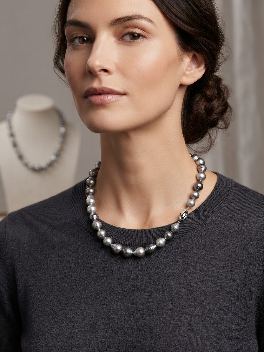 Baroque Tahitian pearl necklace worn with a dark top
