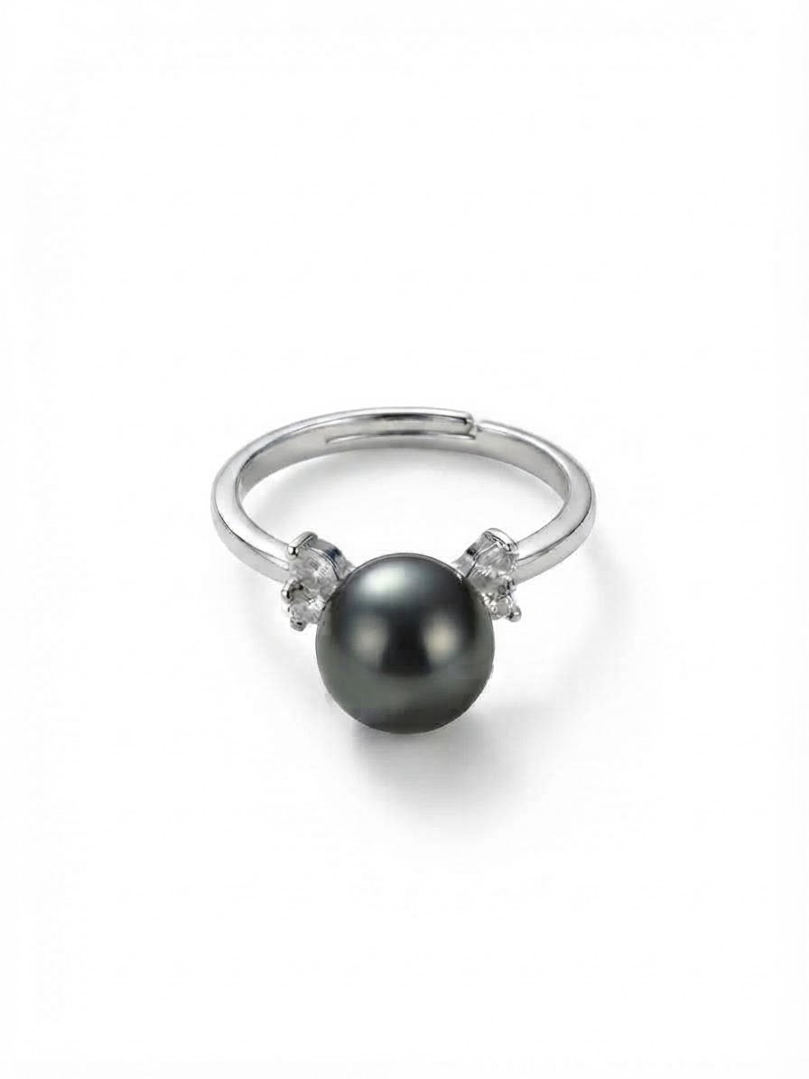 Tahitian pearl ring in 925 silver with sparkling side stones on a white background