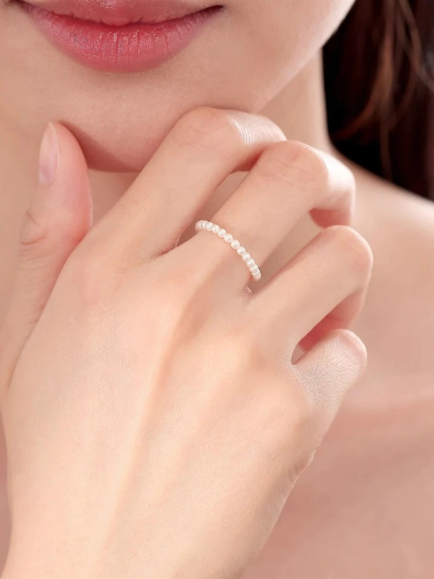 Freshwater baby pearl stacking ring worn on the hand