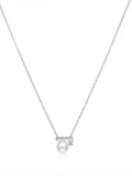 Akoya pearl bar pendant with sparkling stone on a silver chain, white background