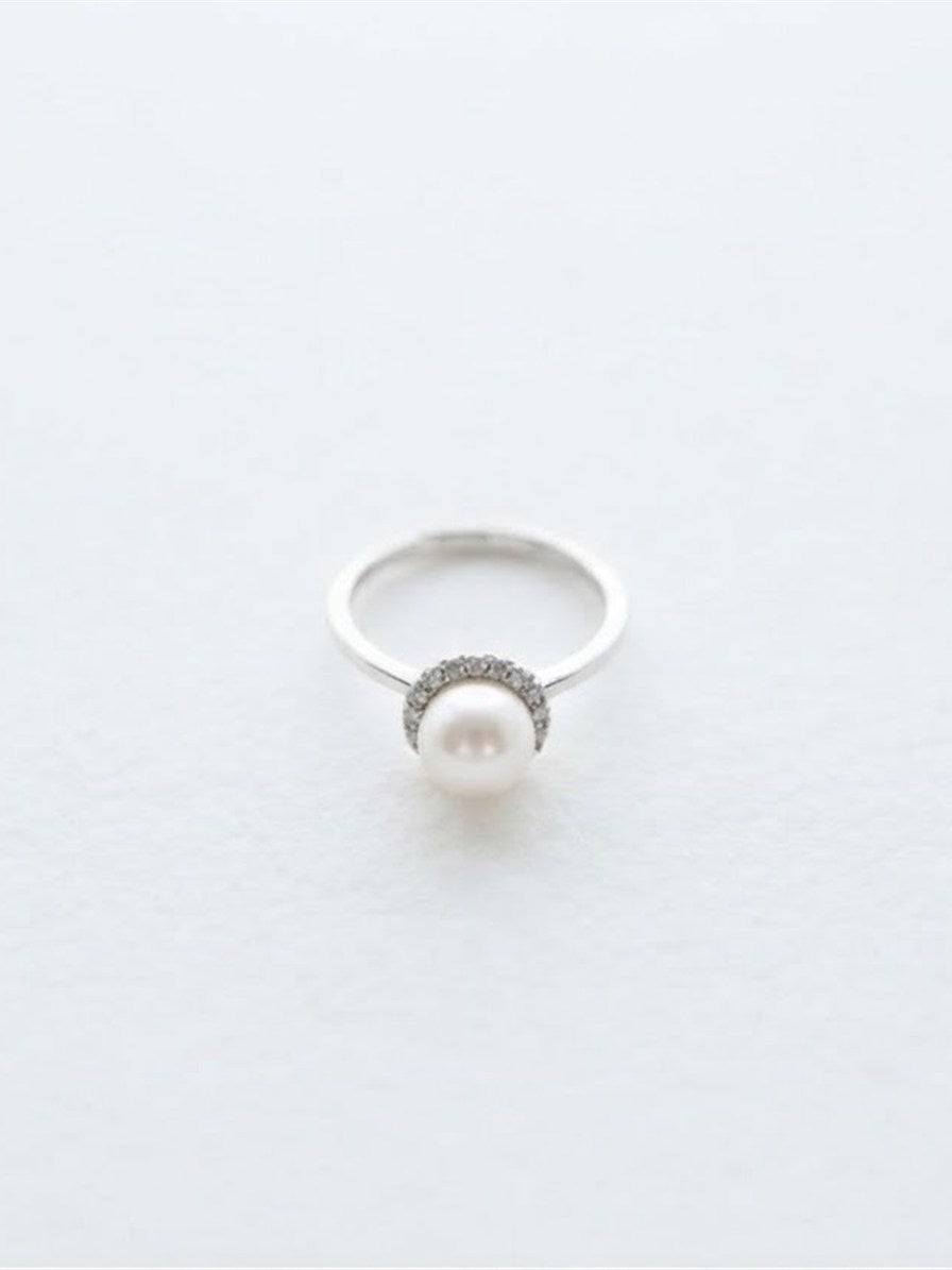 Akoya pearl halo ring in silver on white background