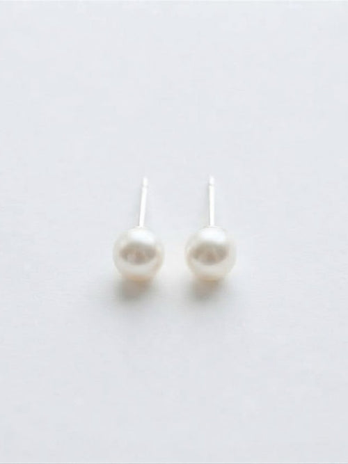 Classic Akoya pearl stud earrings in 18K white gold on white background
