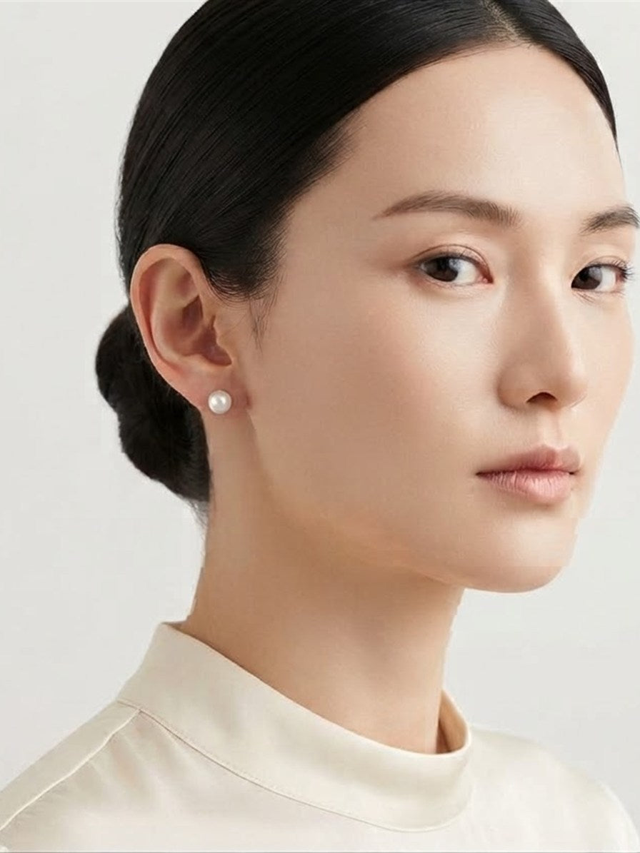 Akoya pearl stud earring worn on the ear