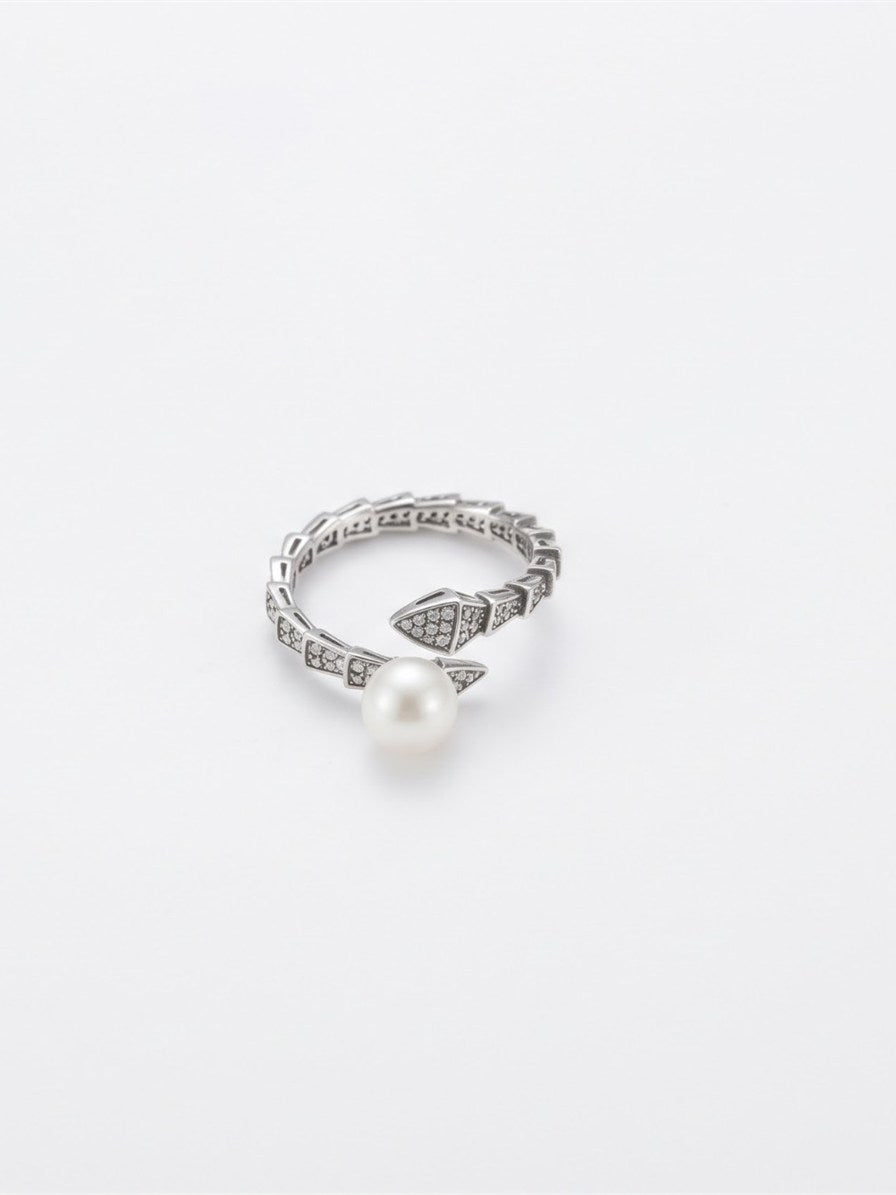 Akoya pearl sparkling scale wrap ring in silver on white background