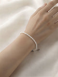 Freshwater baby pearl bracelet in 925 silver worn on the wrist
