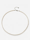 Freshwater baby pearl necklace in 925 silver with heart charm on a white background