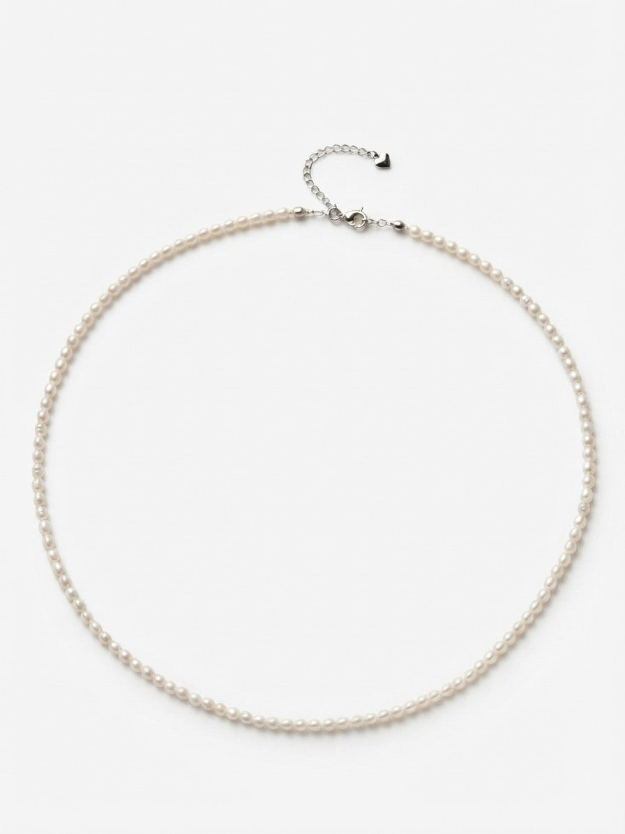 Freshwater baby pearl necklace in 925 silver on a white background