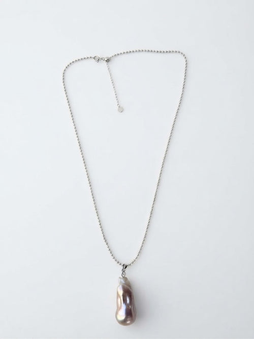 Baroque freshwater pearl pendant on a silver bead chain, white background