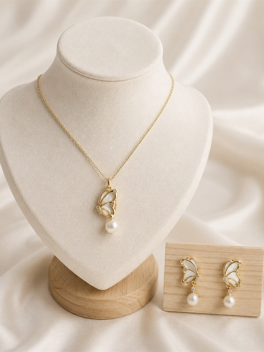 Butterfly freshwater pearl set: pendant necklace on a bust and matching drop earrings