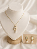 Butterfly freshwater pearl set: pendant necklace on a bust and matching drop earrings