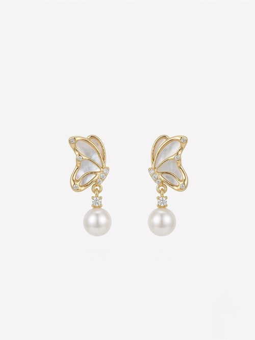 Butterfly drop earrings with freshwater pearls, close-up