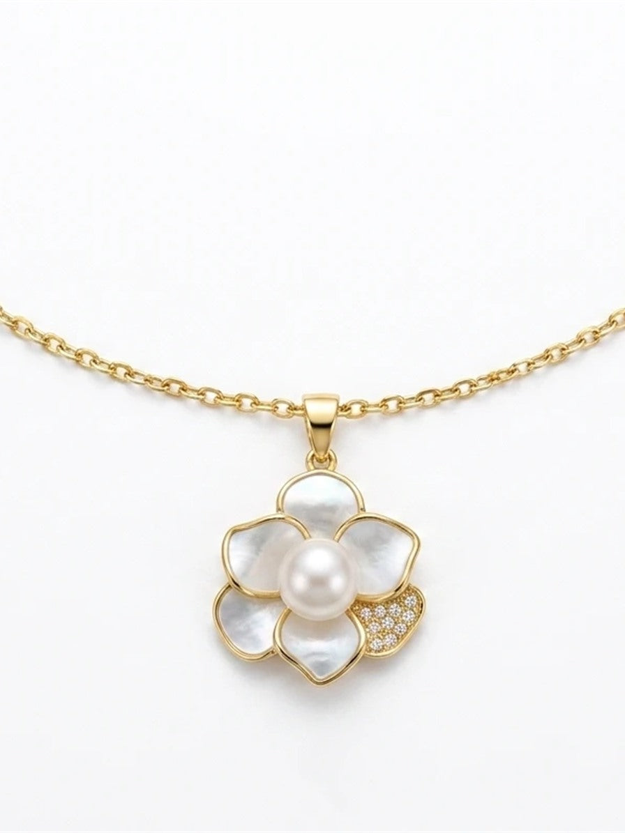 Gold-tone camellia pendant with a freshwater pearl on a fine chain