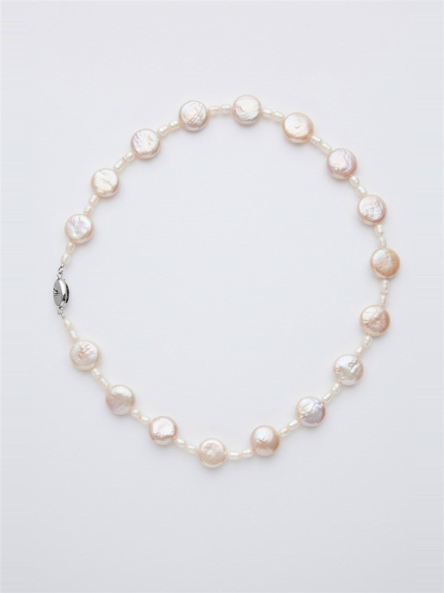 Freshwater coin pearl necklace with silver clasp on white background