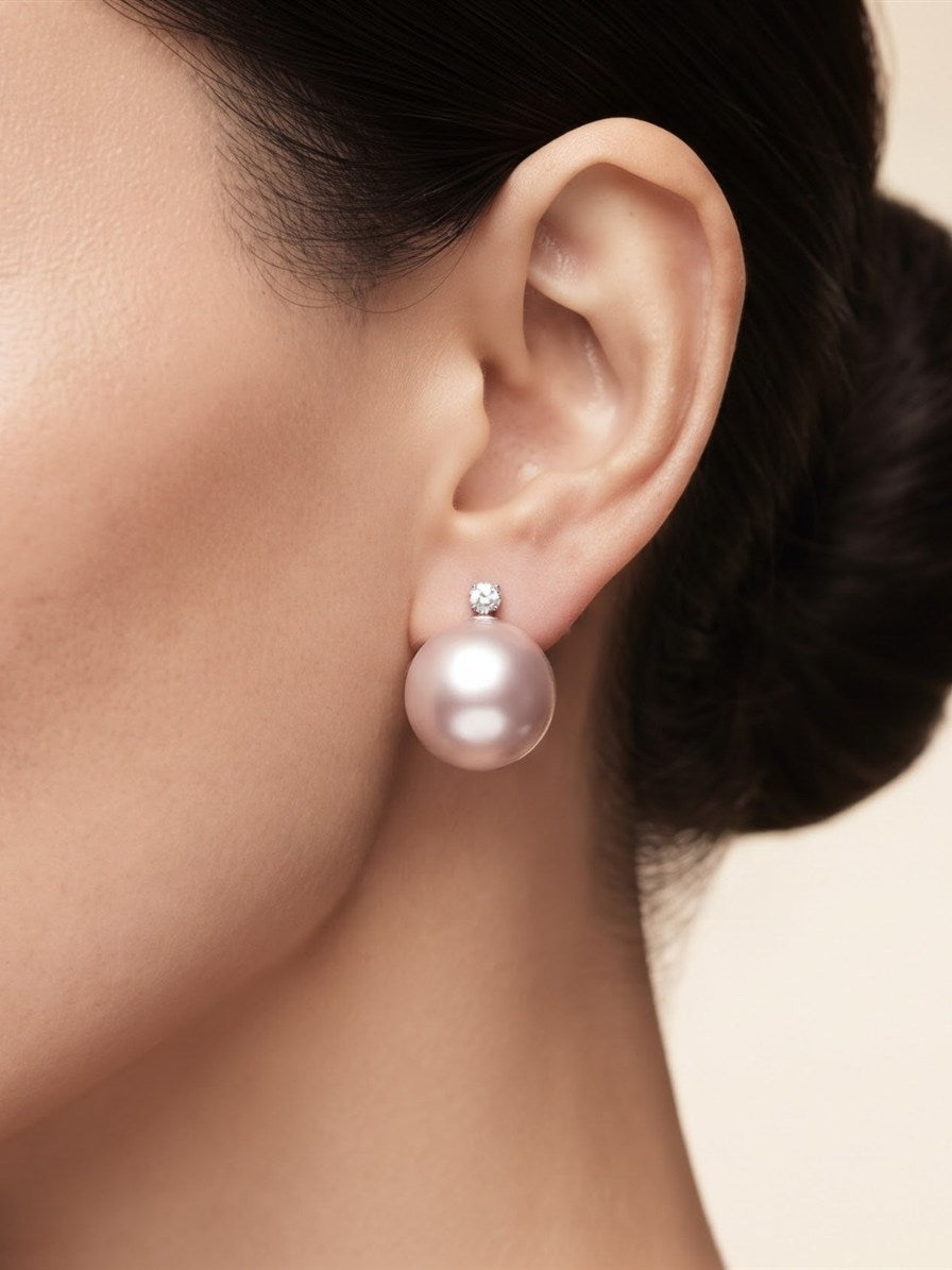 Large lavender pearl earring with sparkling stone worn on the ear