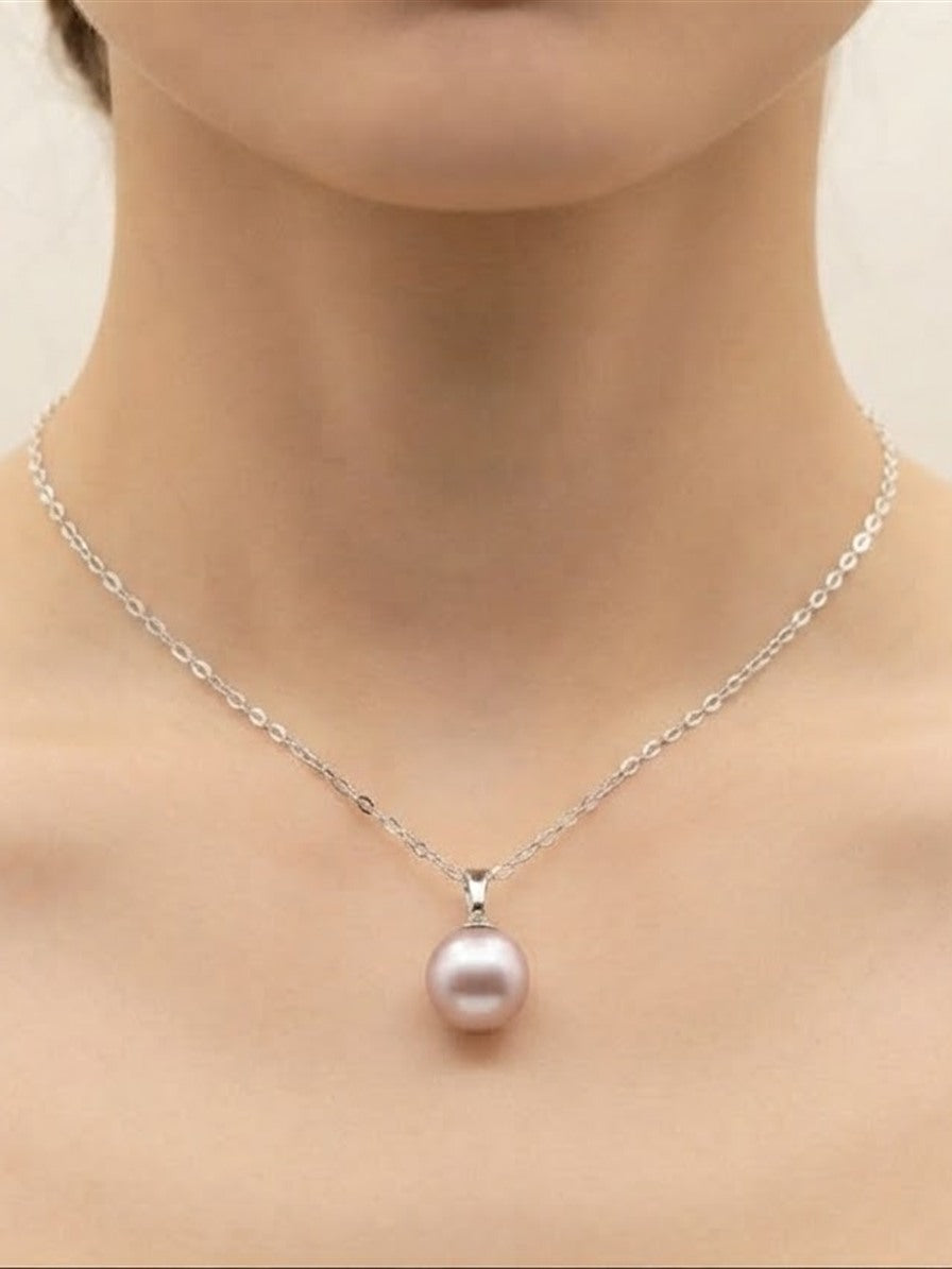 Classic lavender pearl pendant necklace worn at the collarbone