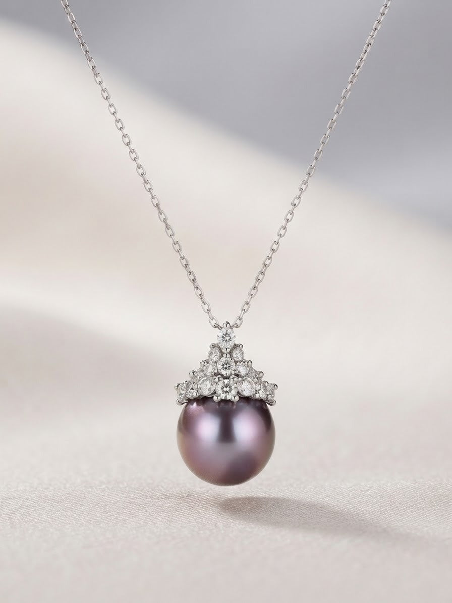 Close-up of the pearl and sparkling stone cluster on the lavender pearl pendant