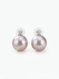Large lavender pearl earrings with four-stone sparkling cluster on white background