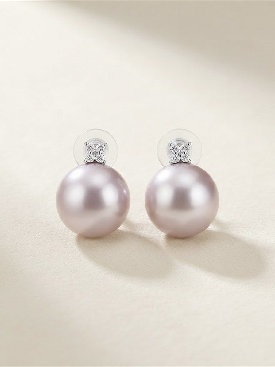 Pair of large lavender pearl cluster earrings in soft light