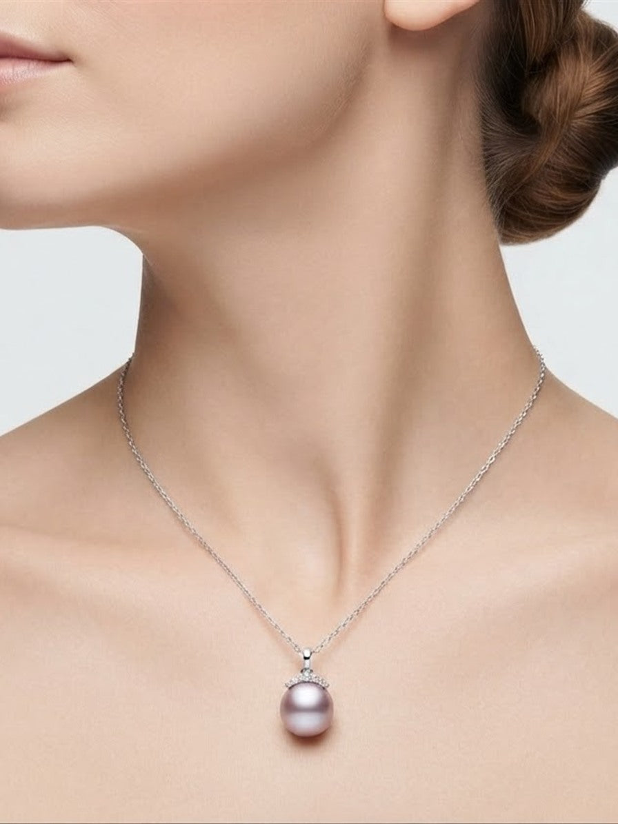 Lavender pearl crown pendant necklace worn at the collarbone