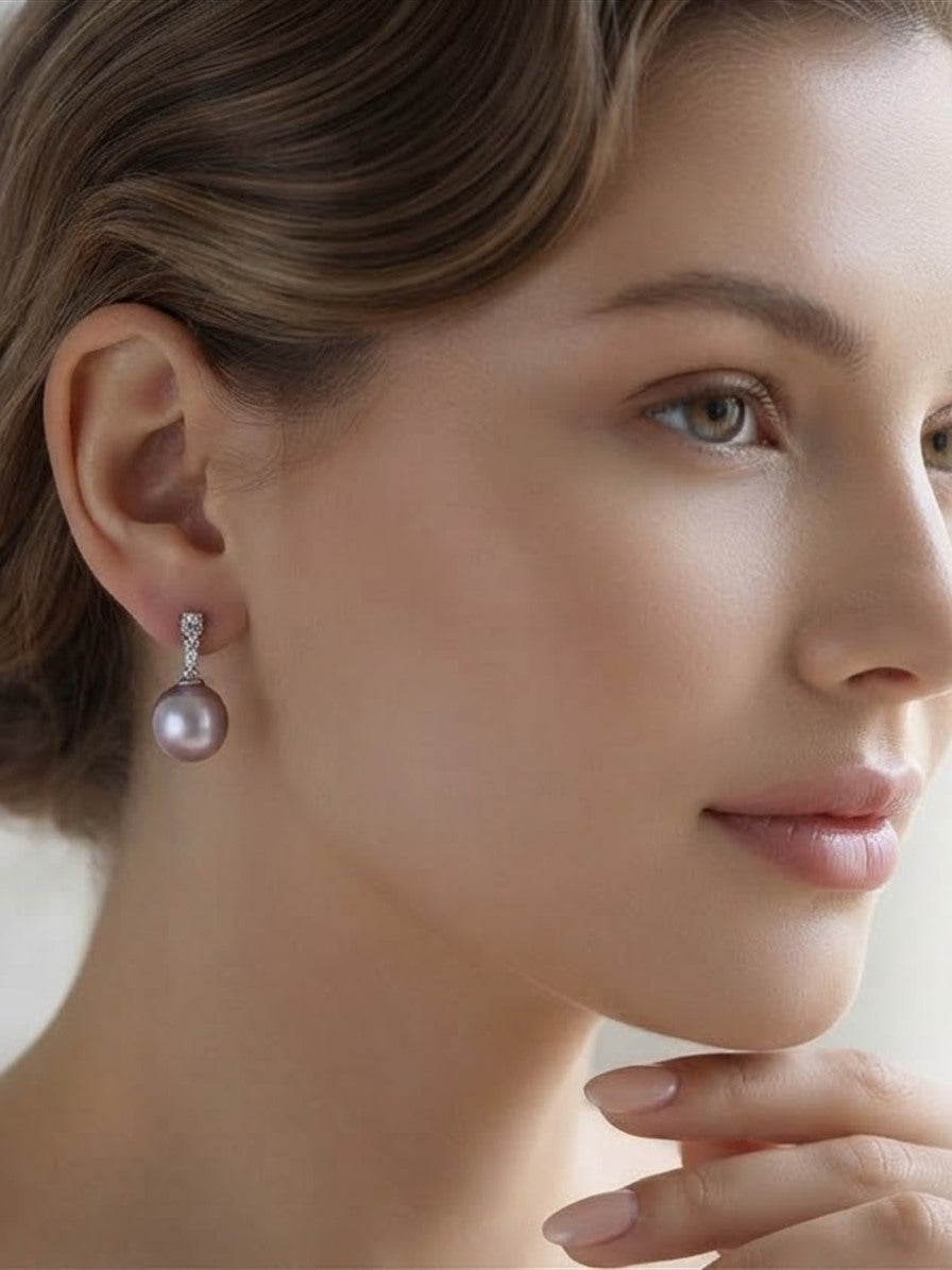 Model wearing a lavender pearl drop earring