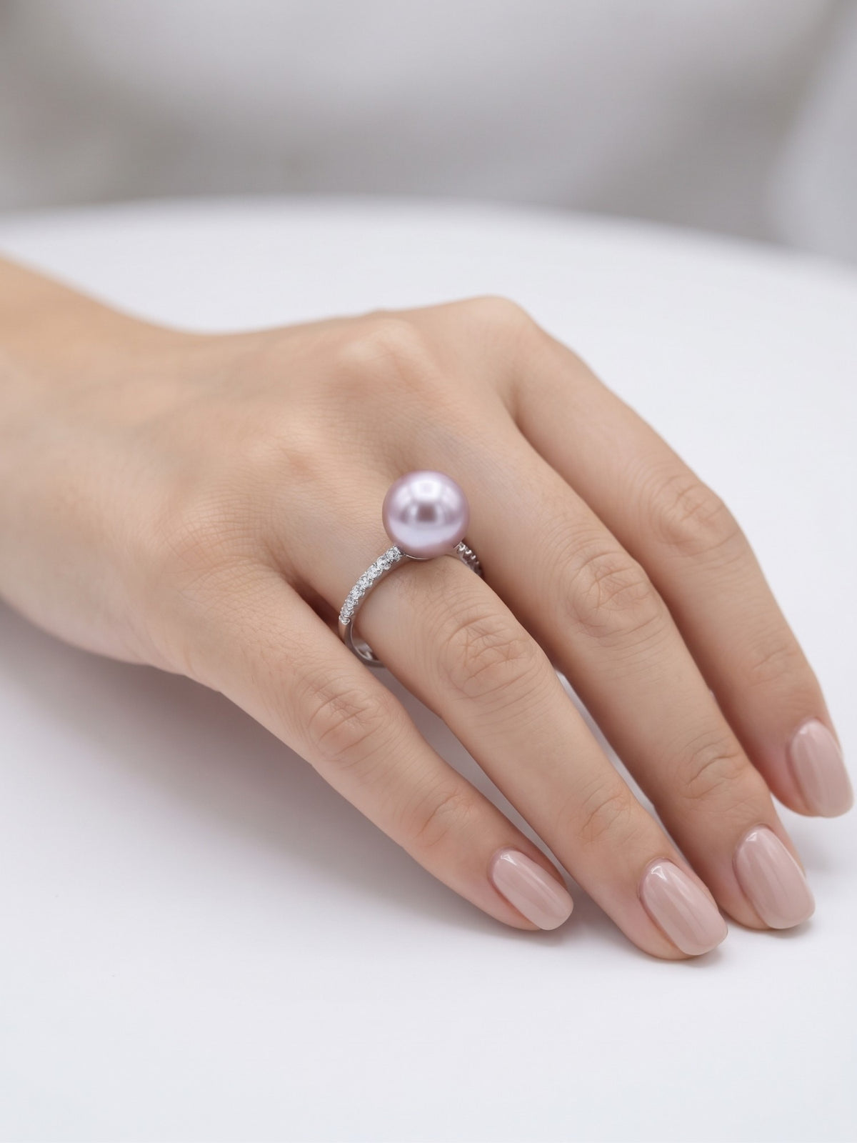 Lavender pearl pavé ring worn on the hand