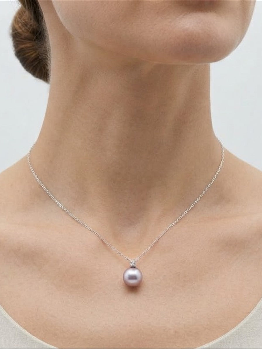 Lavender pearl pendant necklace worn at the collarbone