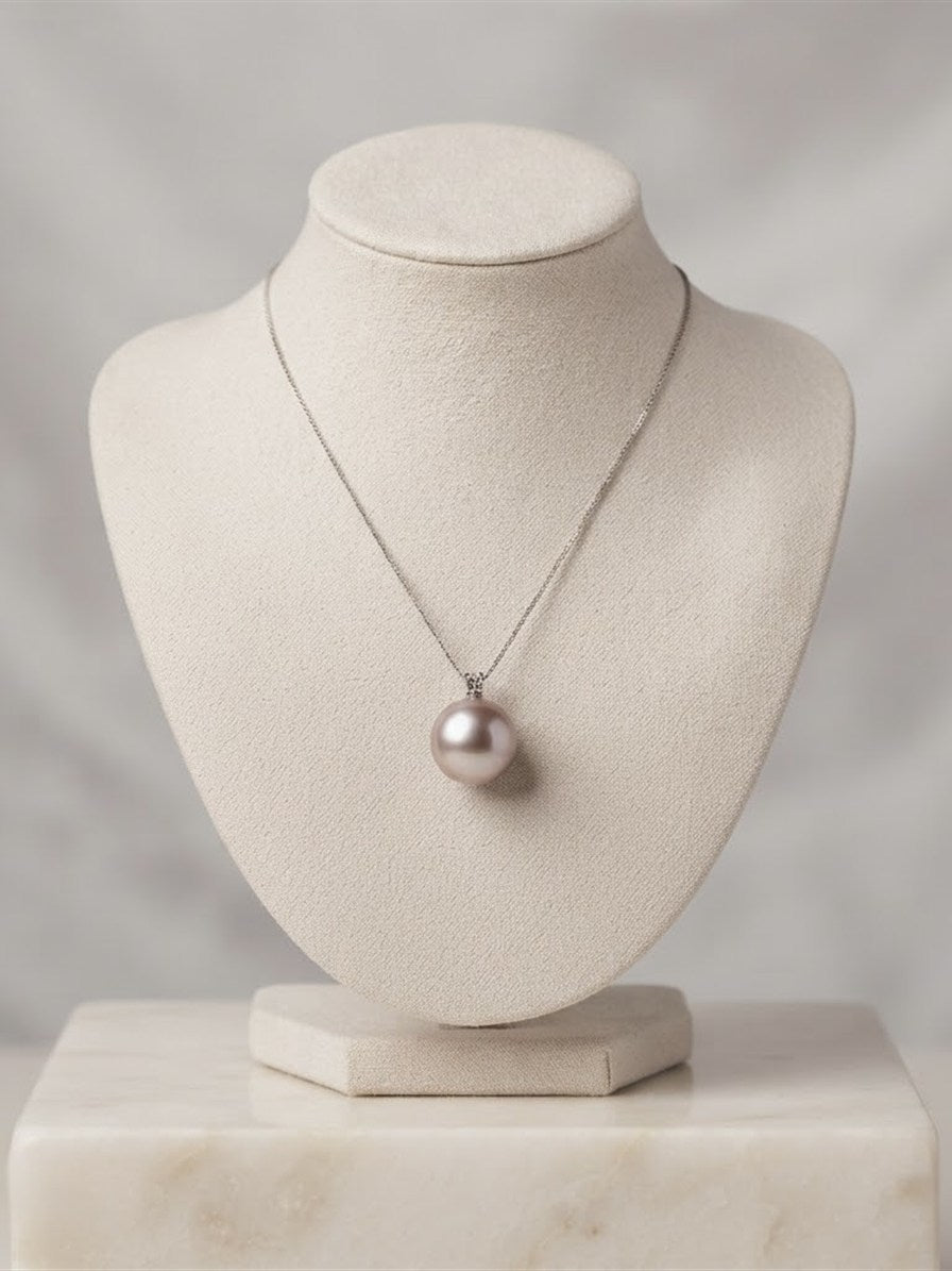 Large lavender pearl pendant on a display bust