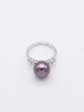 Lavender pearl ring with sparkling stone shoulders in 925 silver on a white background