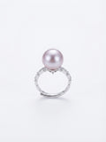 Vintage lavender pearl ring with sparkling stone band on a white background