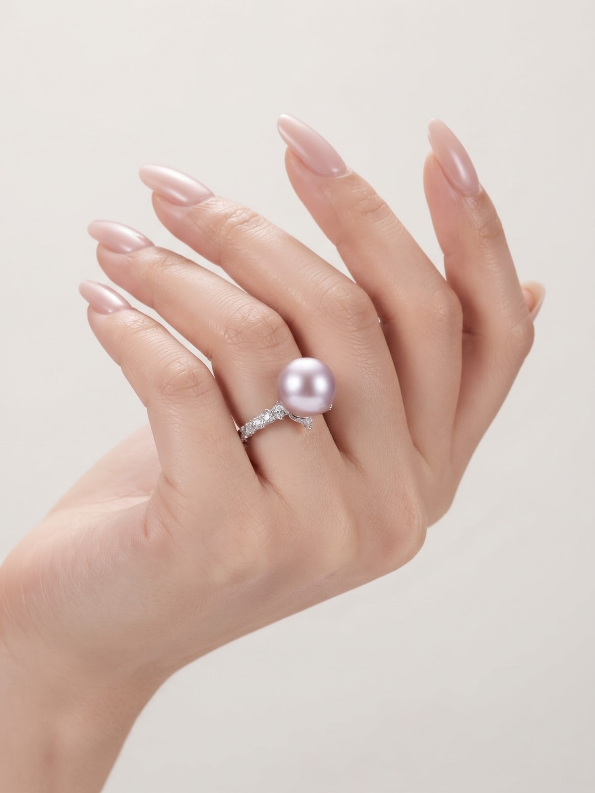 Vintage lavender pearl ring worn on the hand