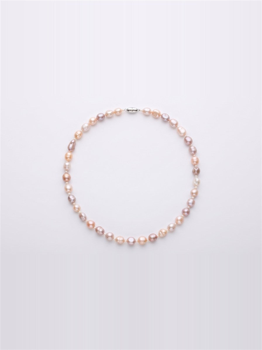 Pastel lavender, blush and peach pearl necklace on white background