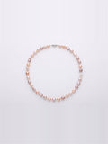 Pastel lavender, blush and peach pearl necklace on white background