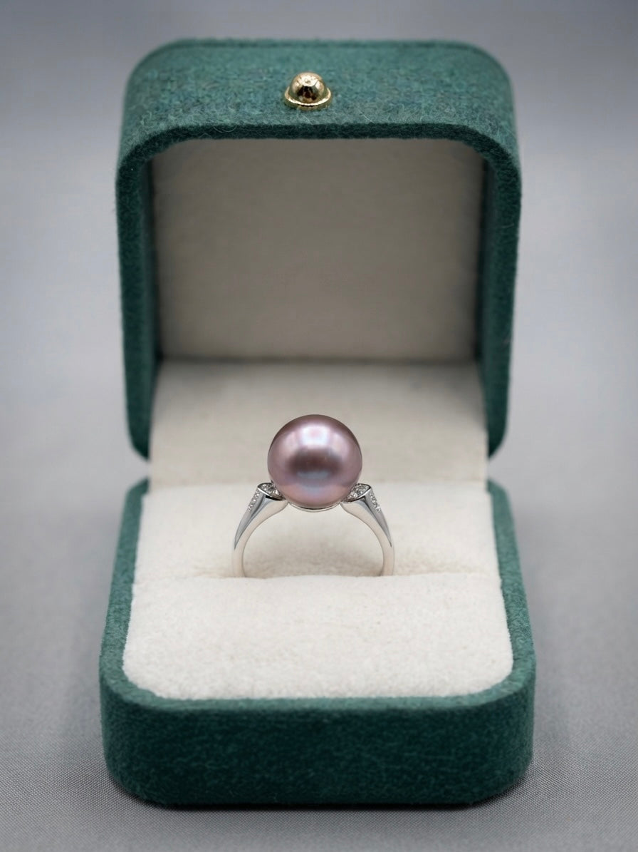 Lavender pearl ring presented in a green velvet gift box