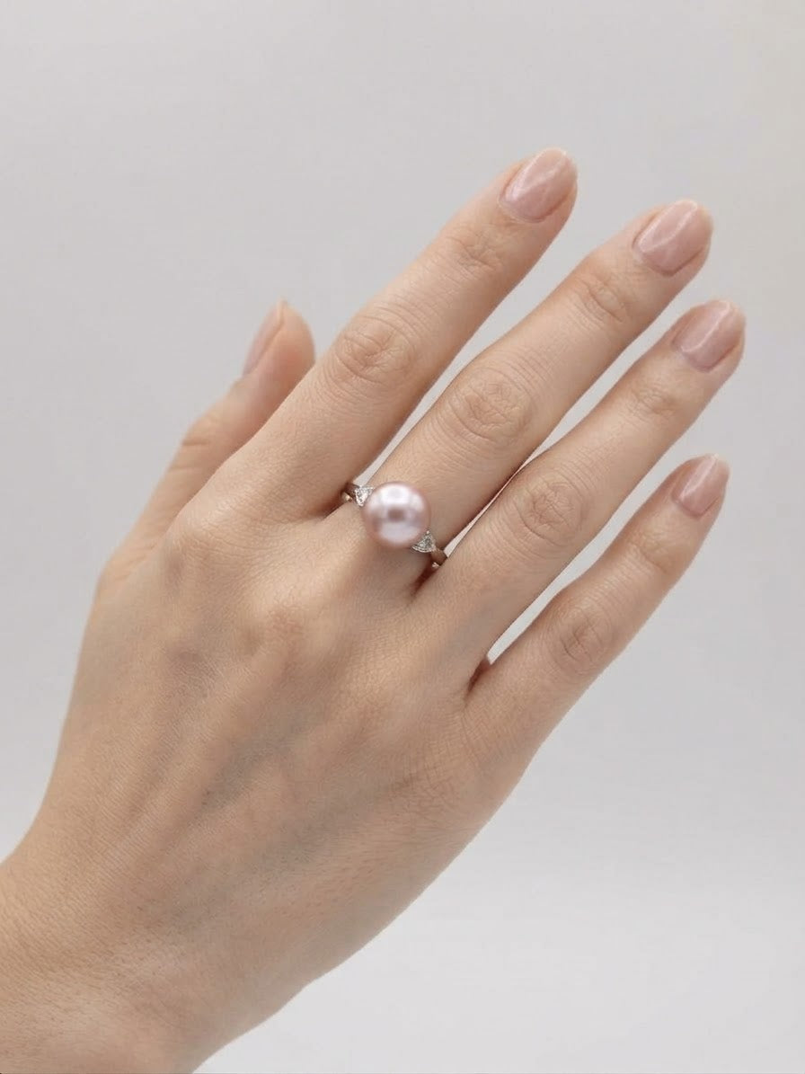 Lavender pearl ring worn on the hand