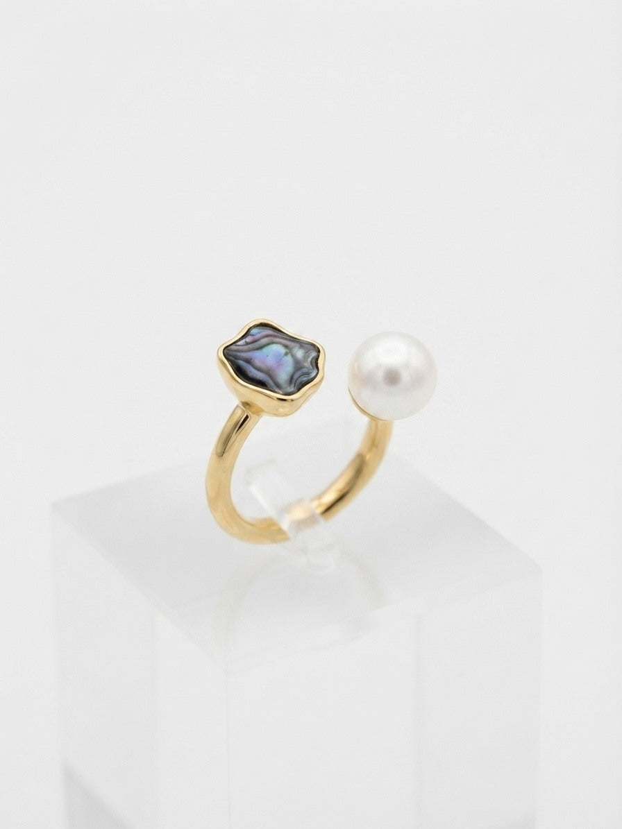 Open ring with a freshwater pearl and iridescent wave inlay