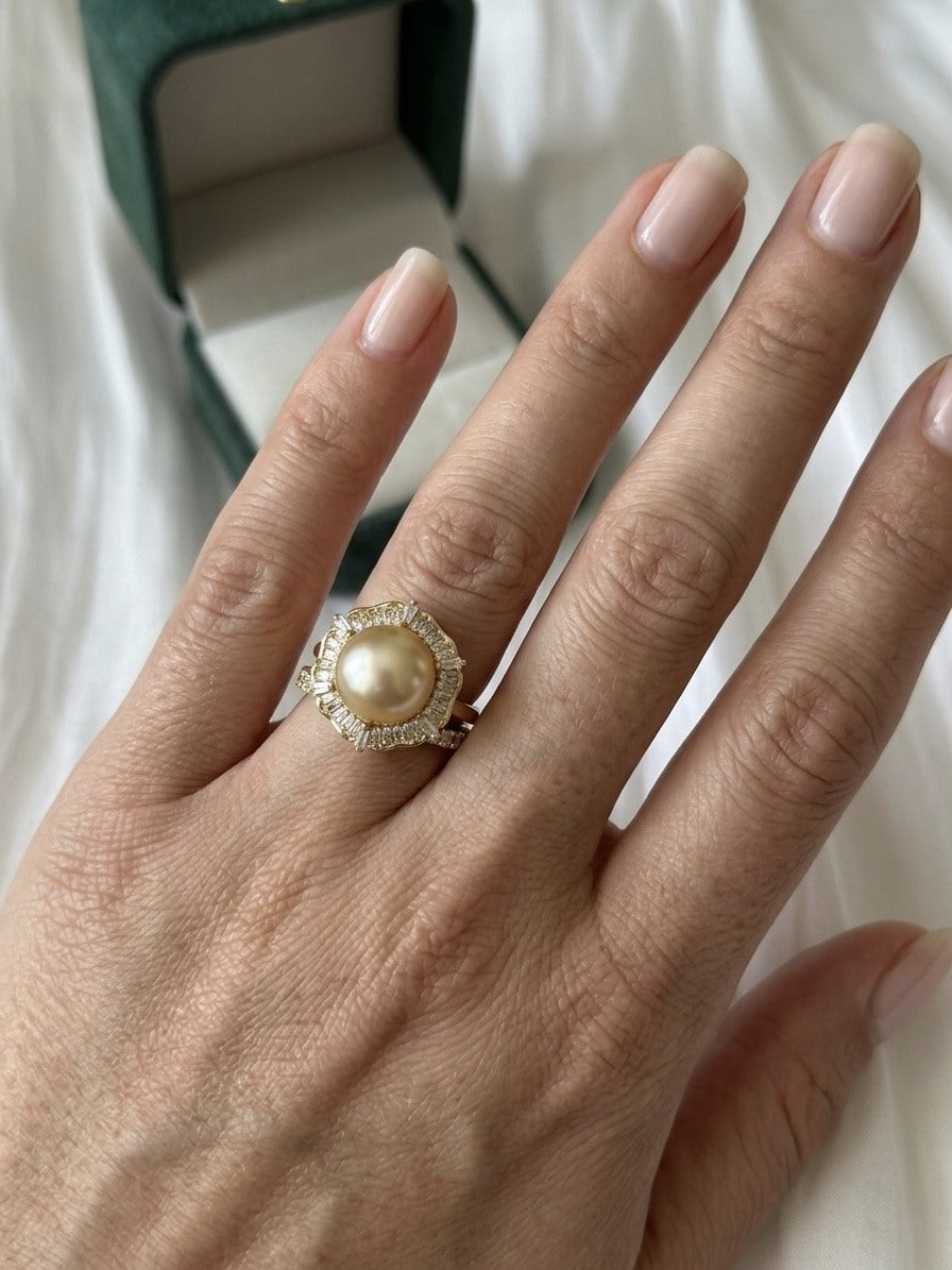 Golden South Sea pearl baguette halo ring worn on the hand