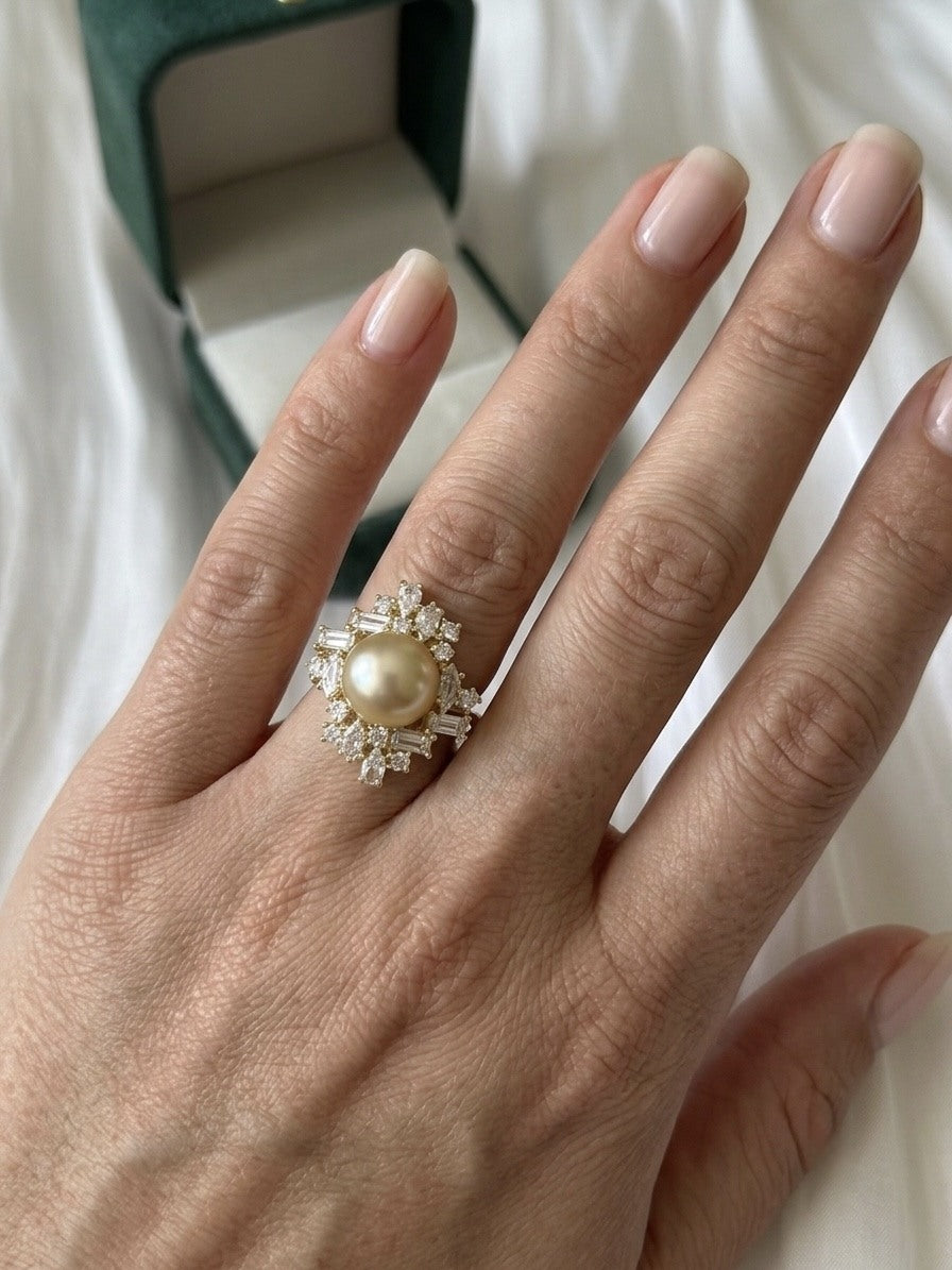 Golden South Sea pearl starburst cluster ring worn on the hand