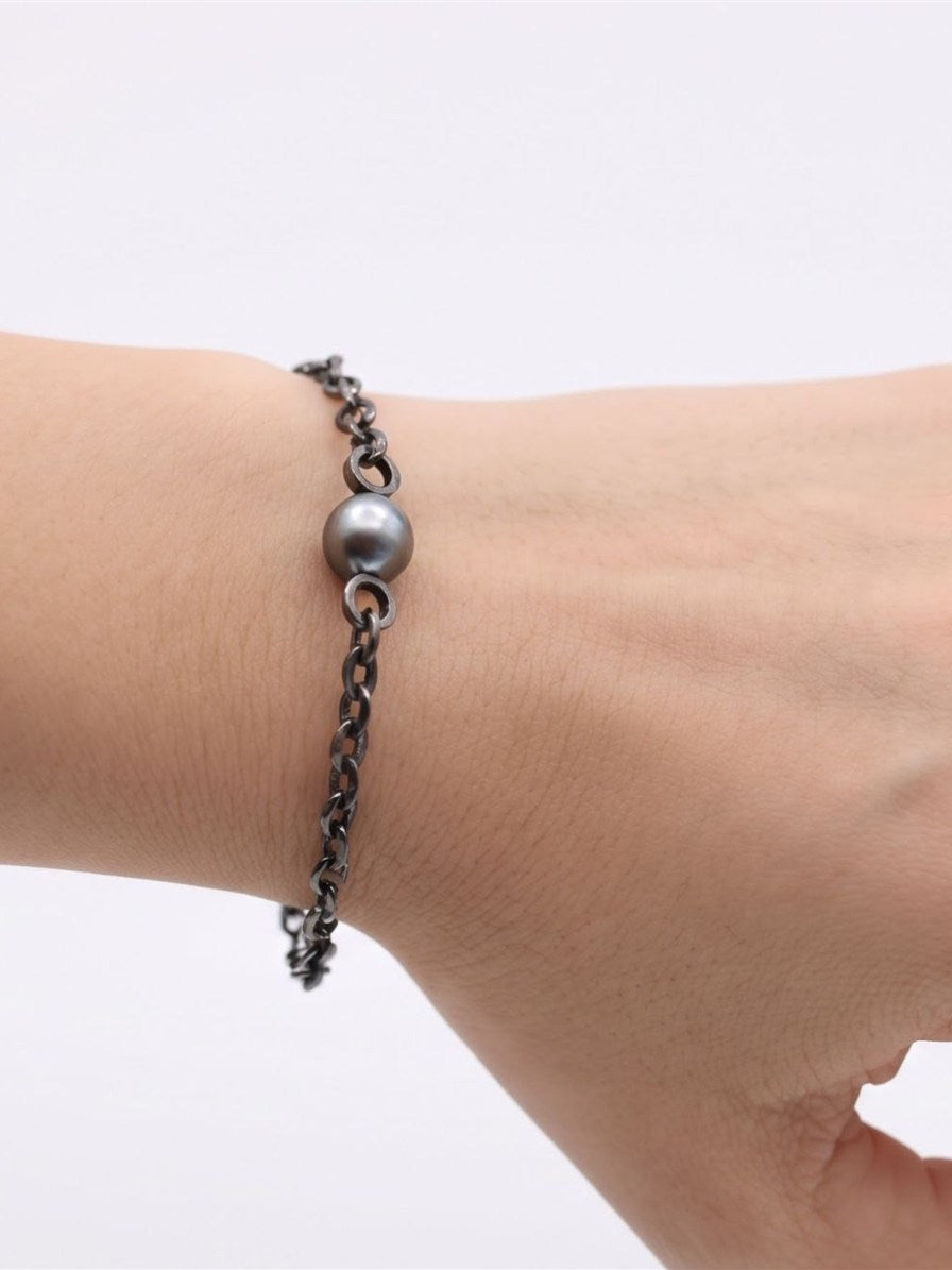 Tahitian pearl chain bracelet worn on the wrist