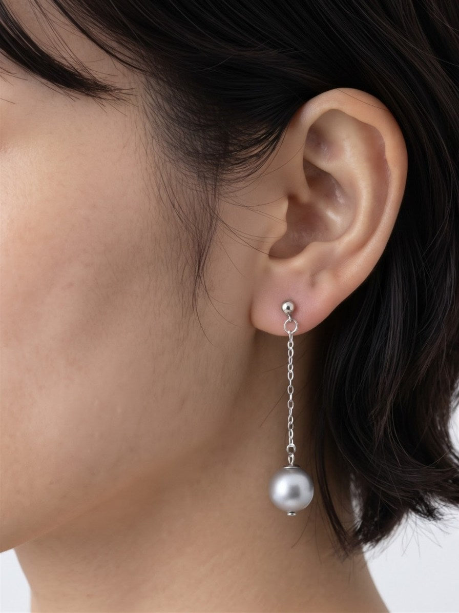 Tahitian pearl chain drop earring worn on the ear
