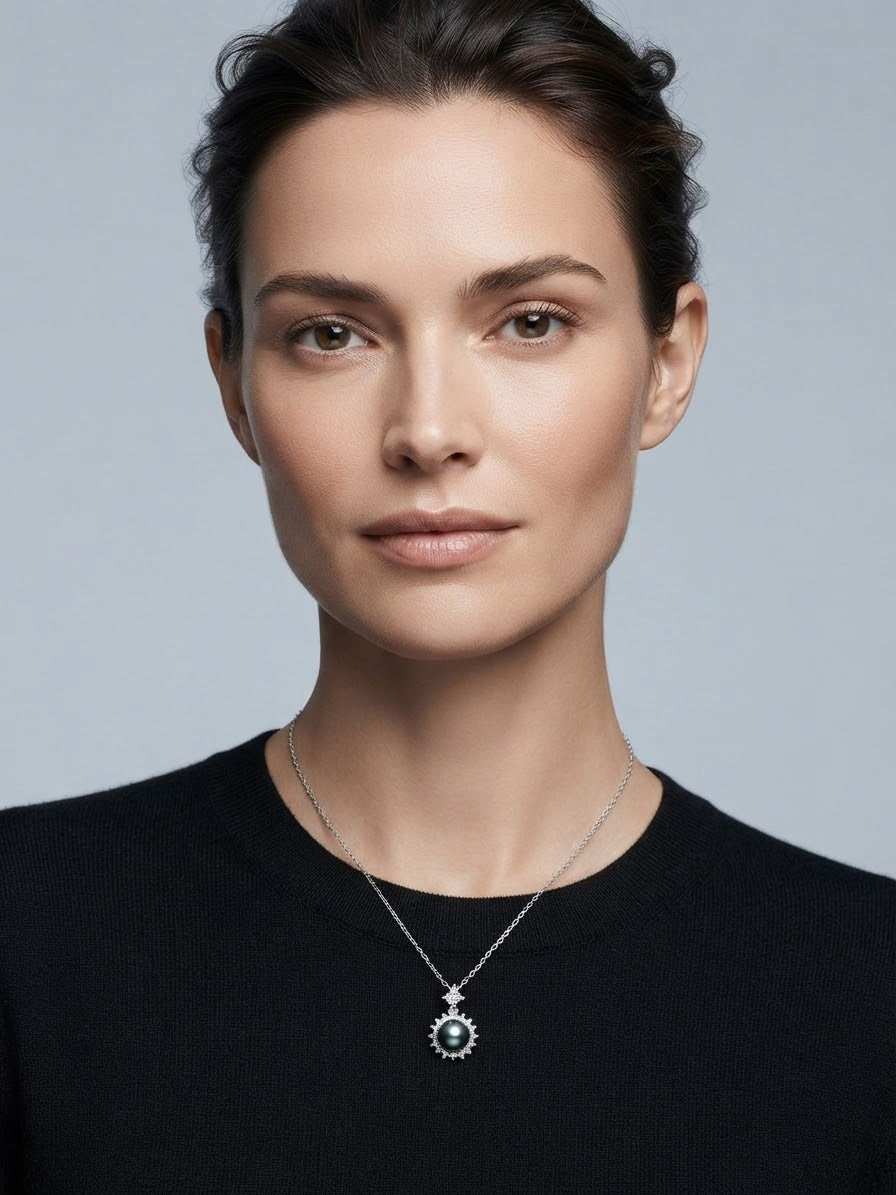 Tahitian pearl halo pendant worn with a black sweater