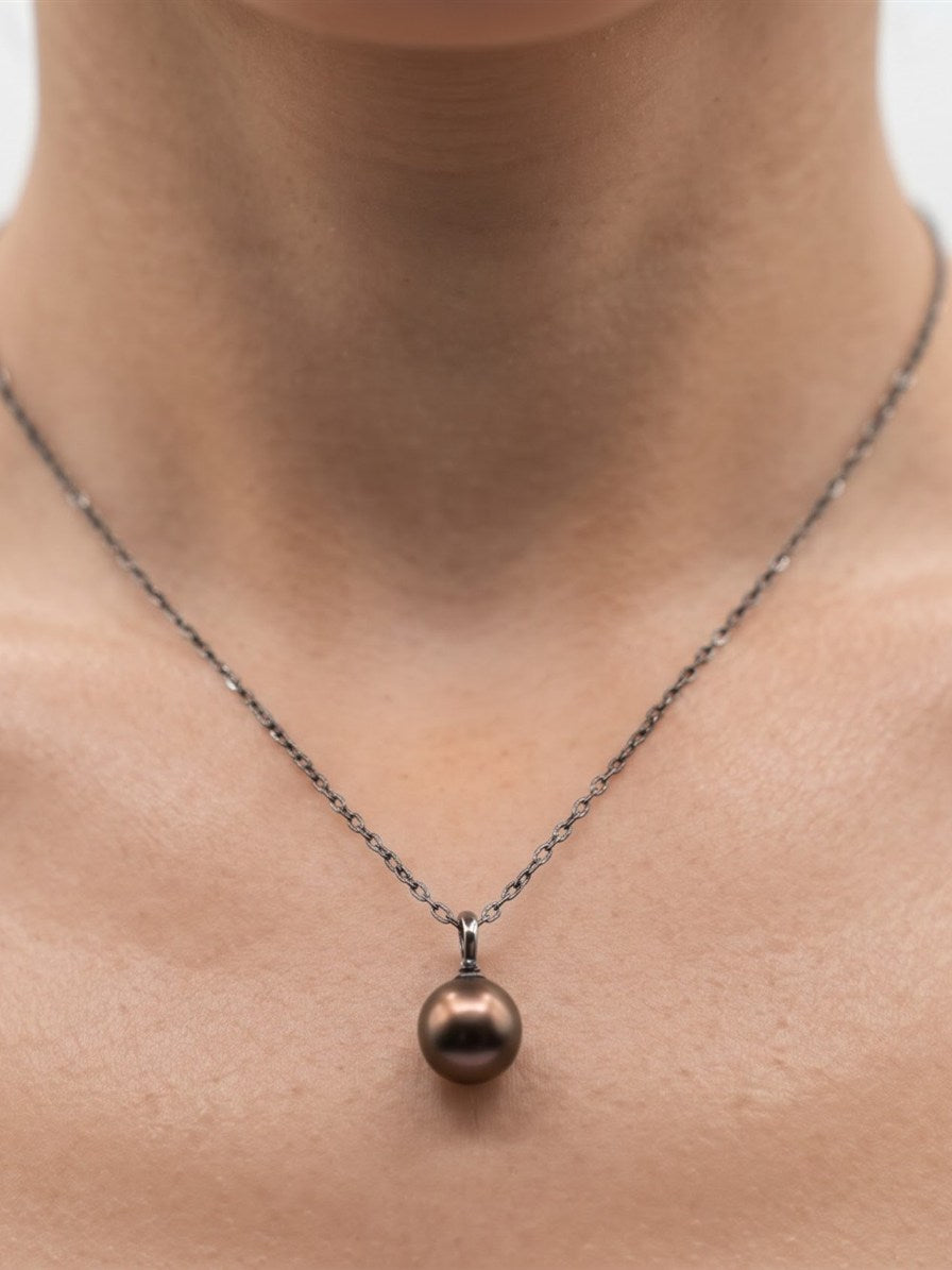 Chocolate Tahitian pearl pendant necklace worn on the neck