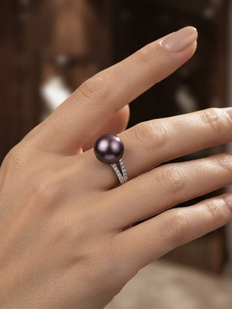 Violet pearl split pavé ring worn on the hand