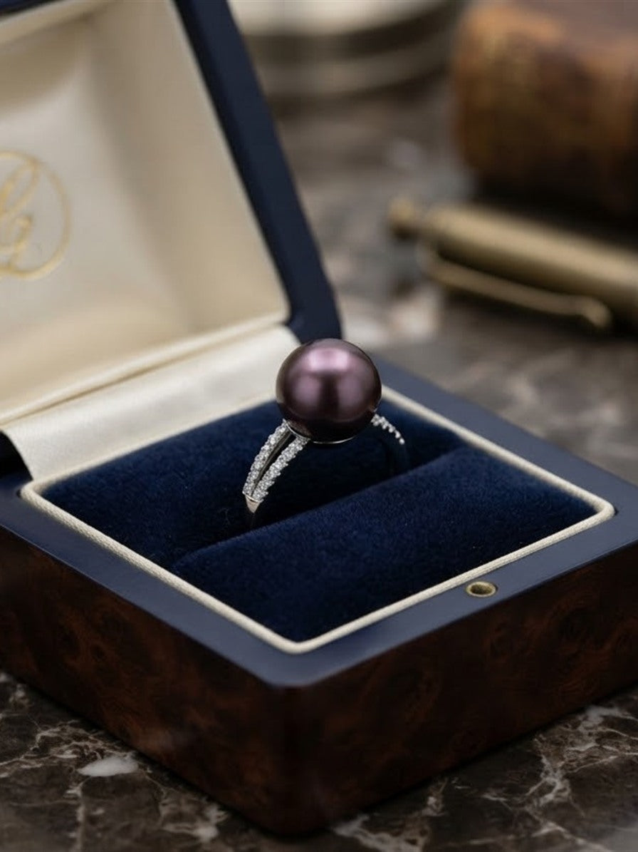Violet pearl split pavé ring in a wooden gift box