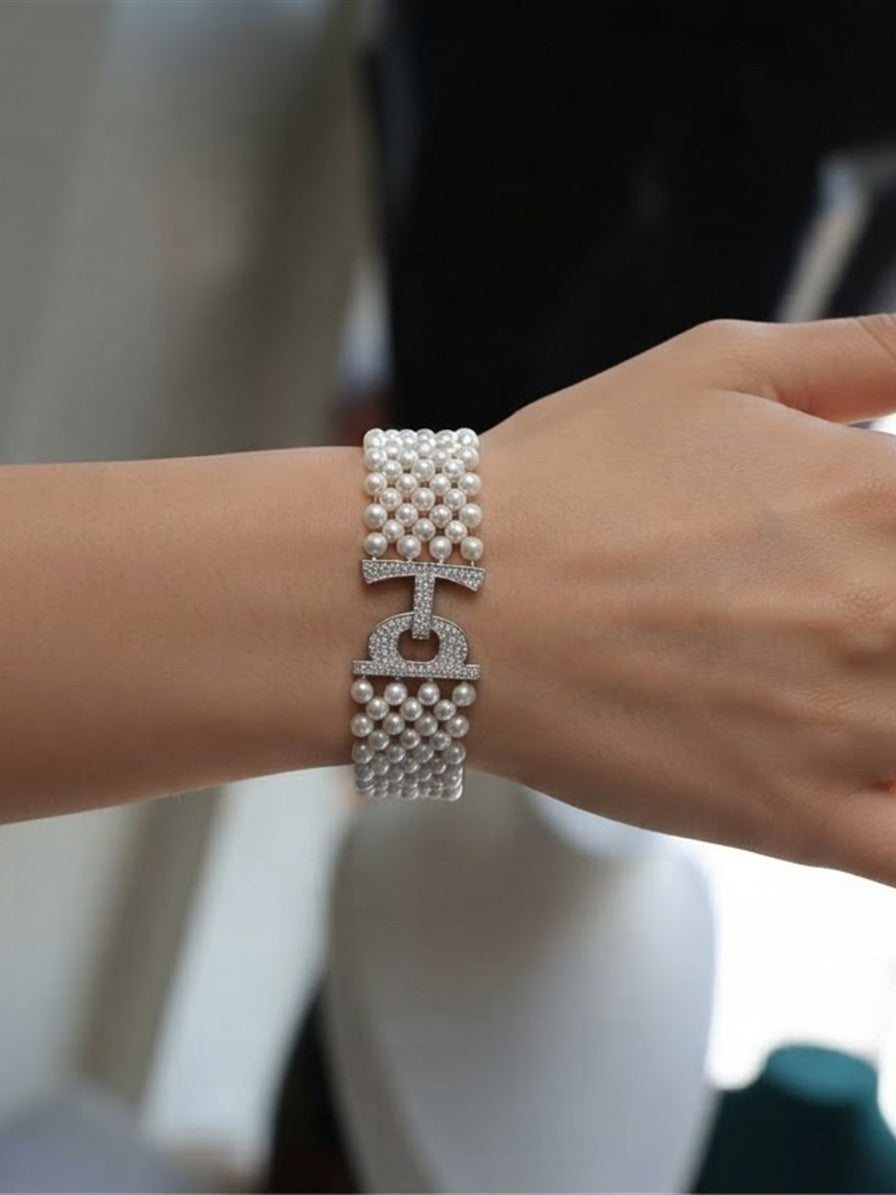 Woven freshwater pearl bracelet worn on the wrist